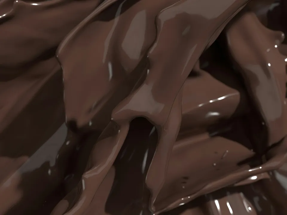 Melted dark chocolate folding over itself.